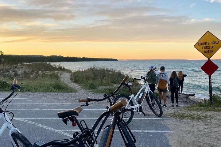 a bicycle parked on a beach