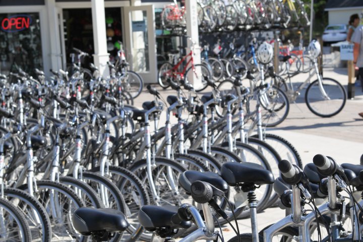 a row of bikes parked in front of a building