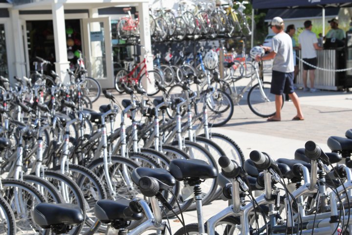 a bicycle is parked near a fence
