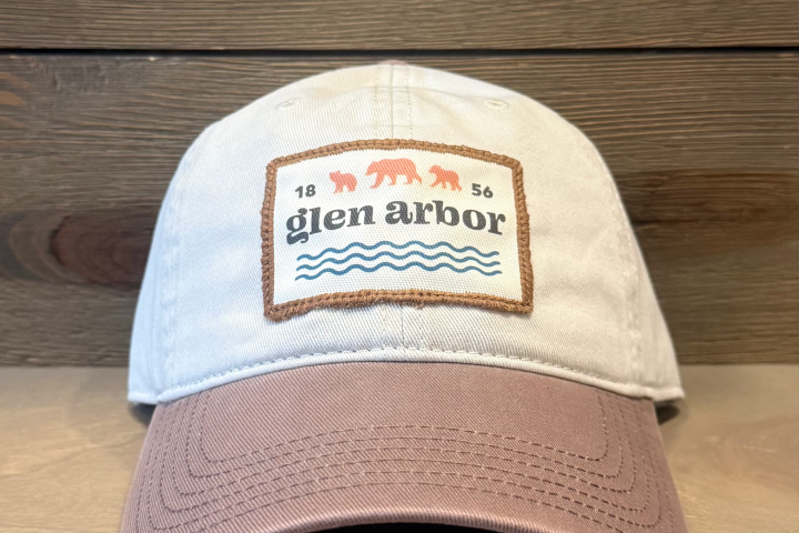 Beige cap with 'glen arbor' patch featuring bears and waves.