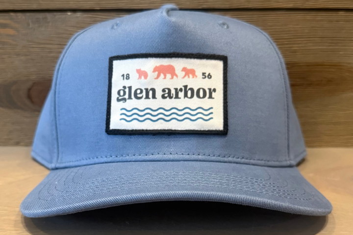 Blue cap with Glen Arbor patch showing three bears and wavy lines.